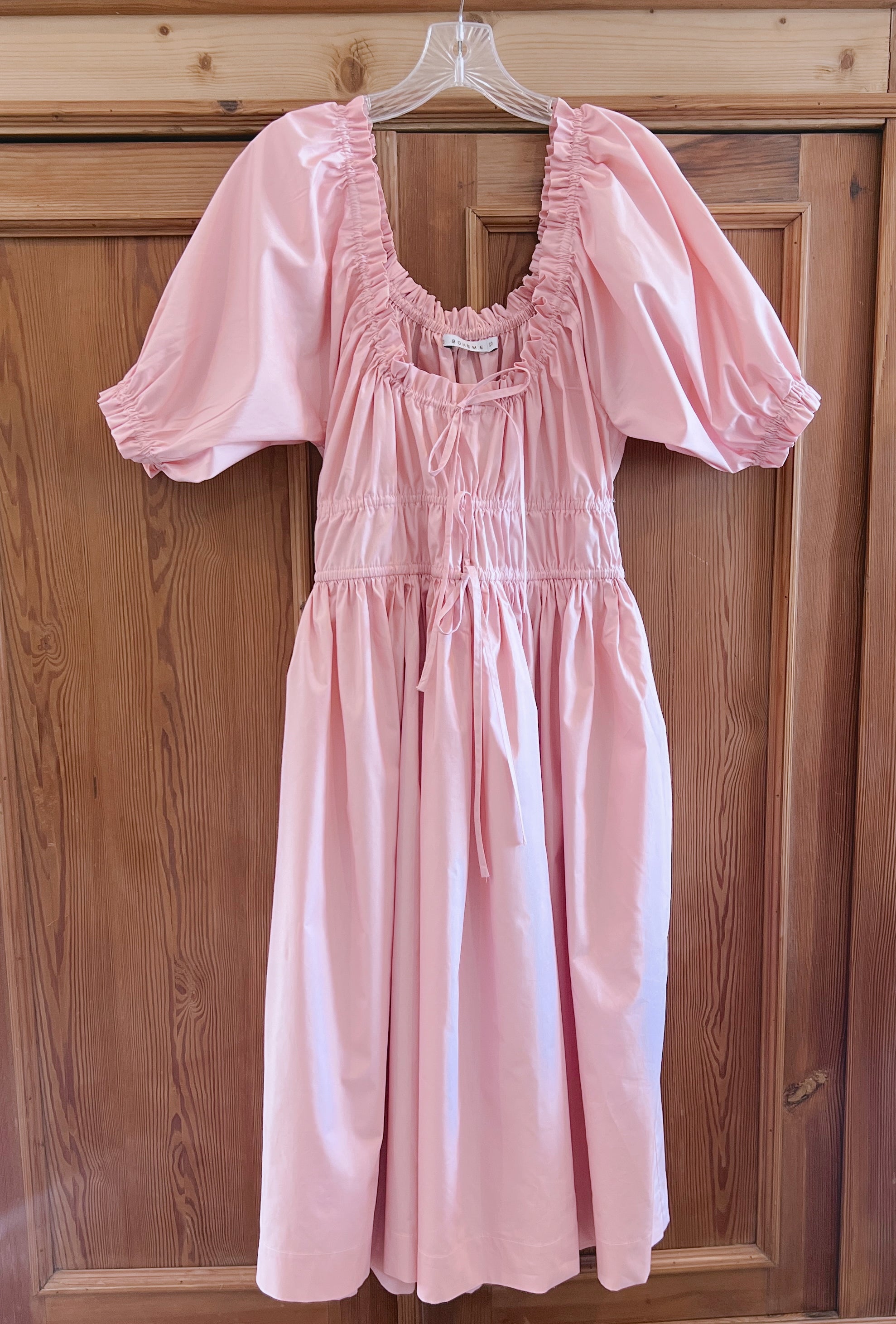 Elle boheme romantic midi dress in pastel pink colour with elasticated puff sleeves and adjustable waist.